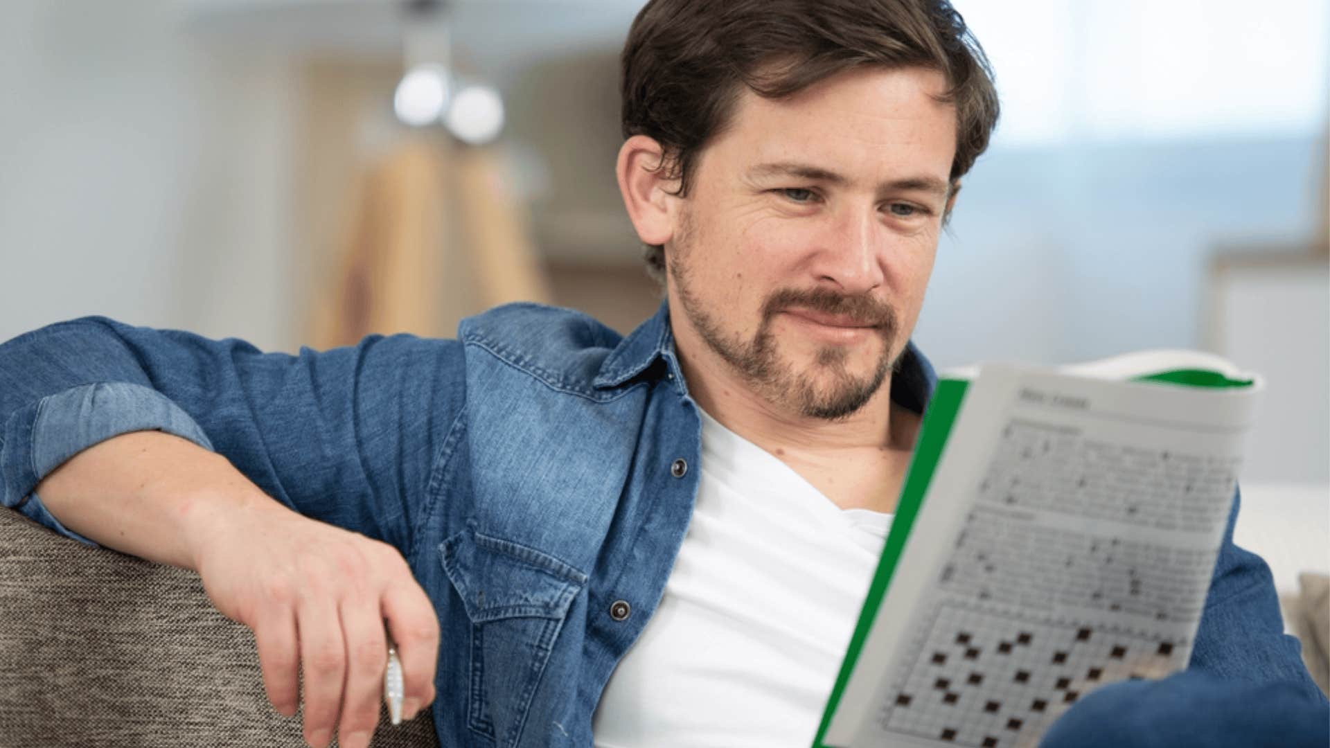 man doing crossword puzzle 