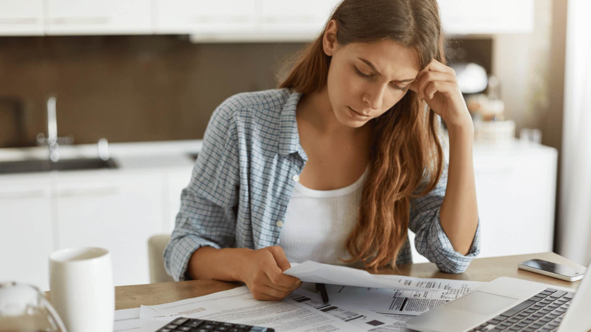 woman revising her yearly budget