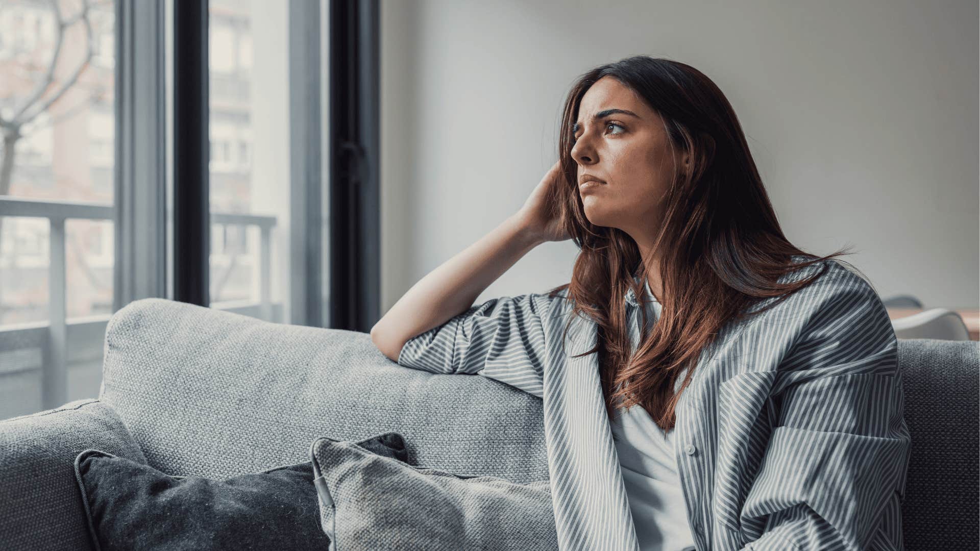 upset woman alone because he doesn't spend time with her