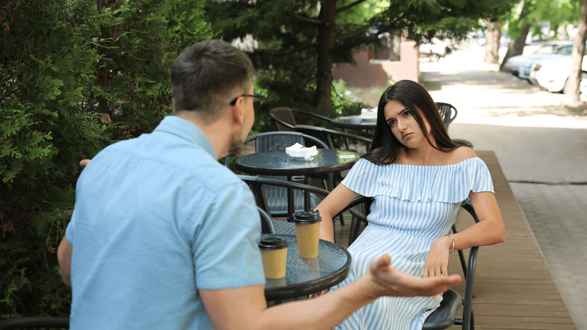 upset woman on a date with a man who doesn't validate her
