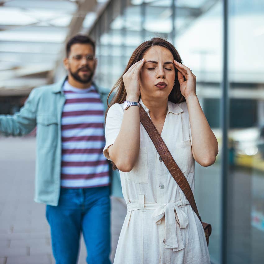 upset woman who's not on his radar walking away from man