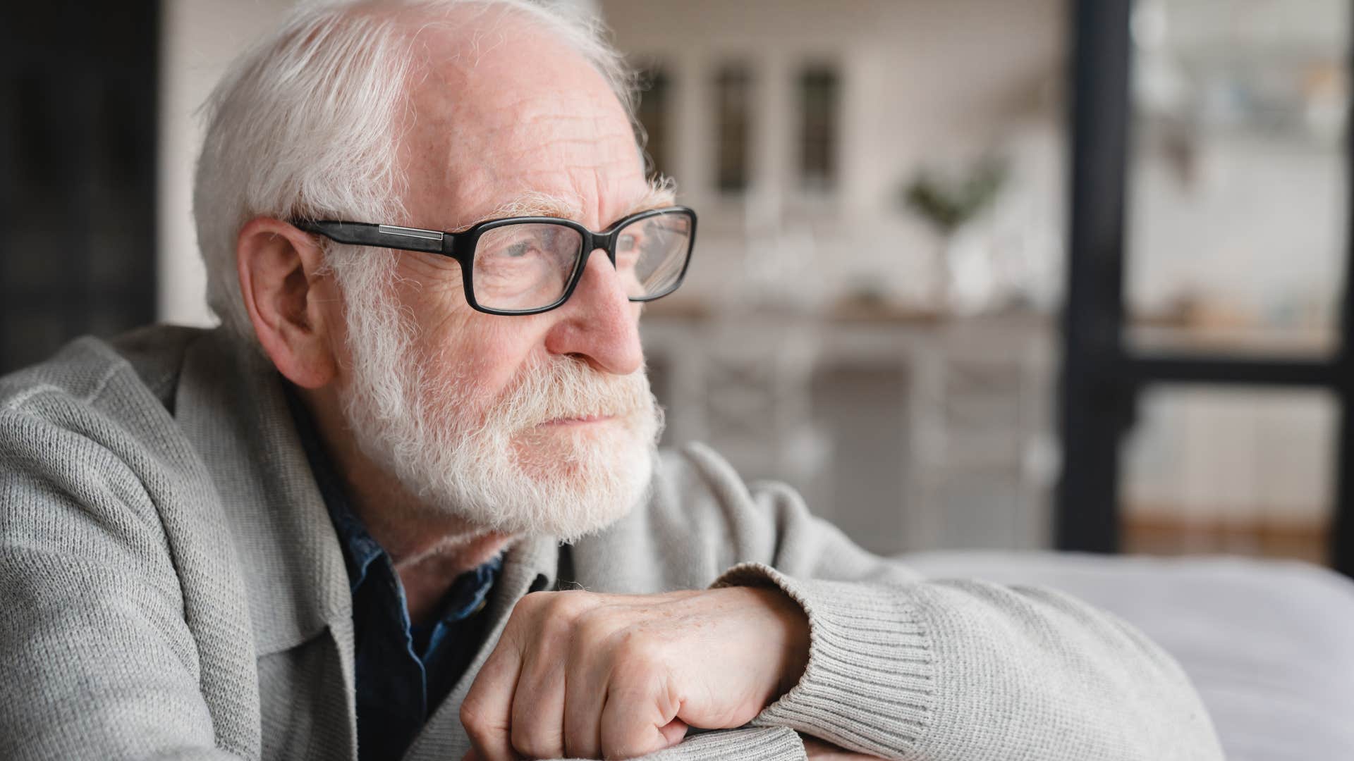 man feeling regret about past mistakes looking sad