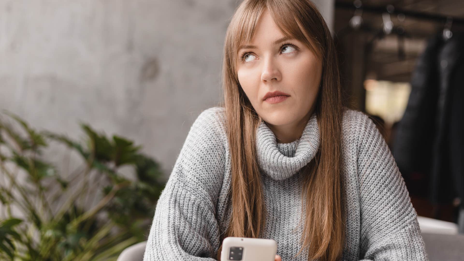 Annoyed woman texting after going on a lot of first dates.