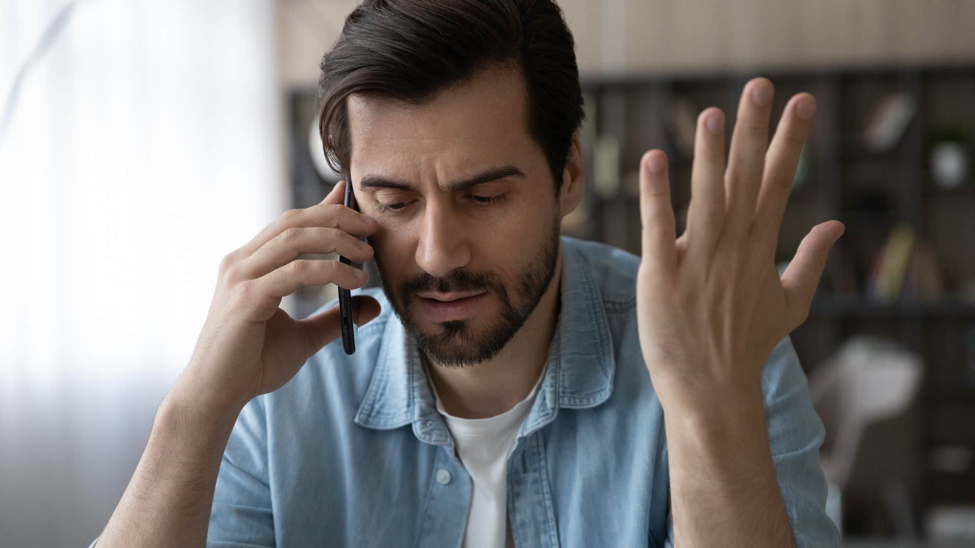 Man trying to make time for all of their friends talking on the phone.