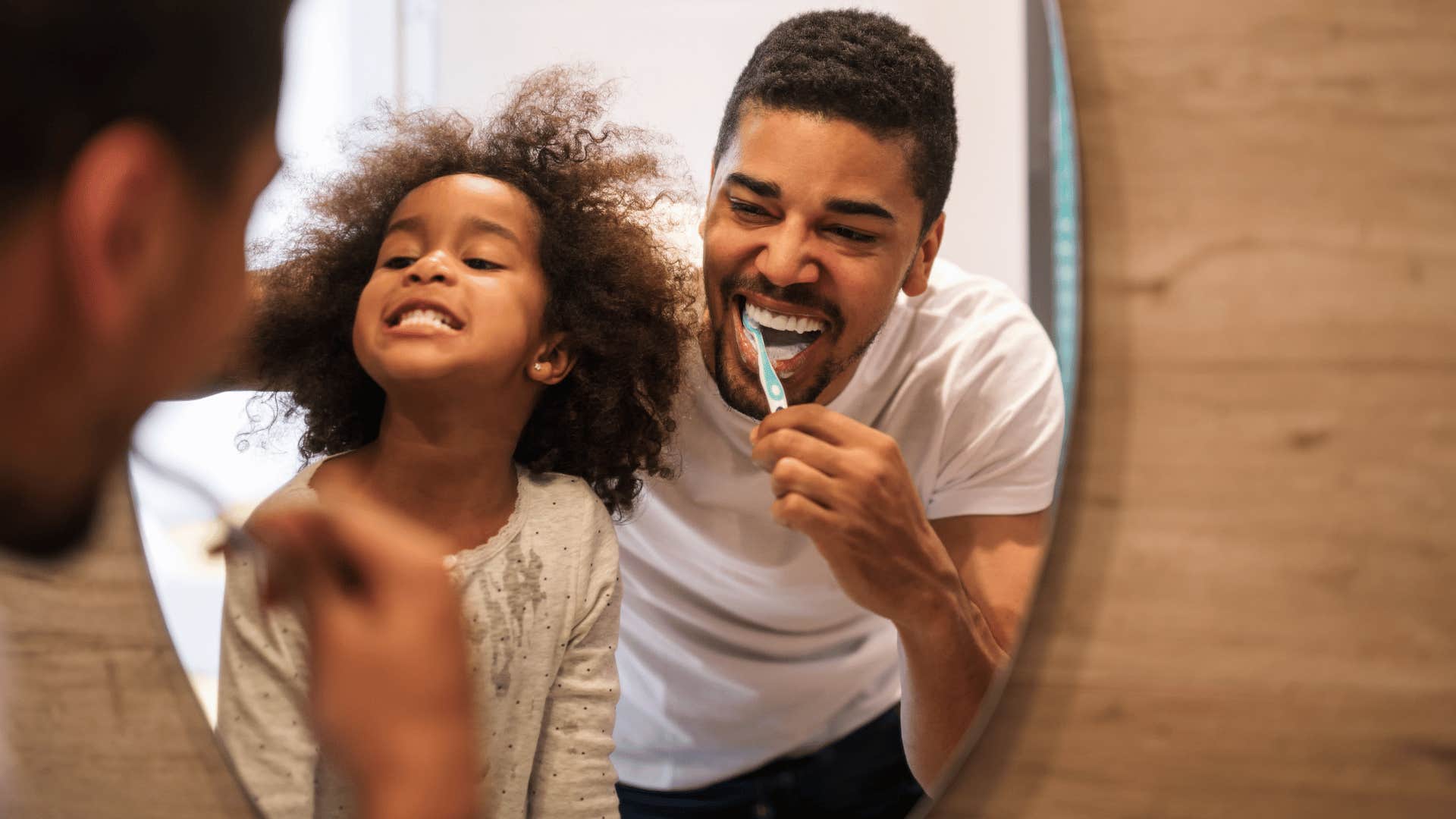 Young girl and her dad getting ready for bedtime