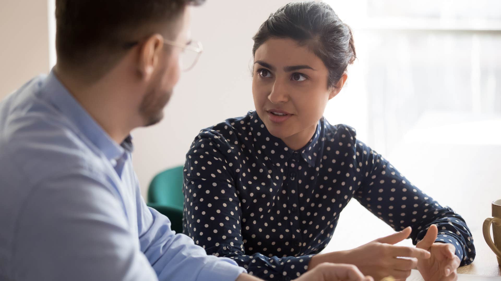Woman talking about how you're most worthy of respect when you have something to offer to her co-worker.