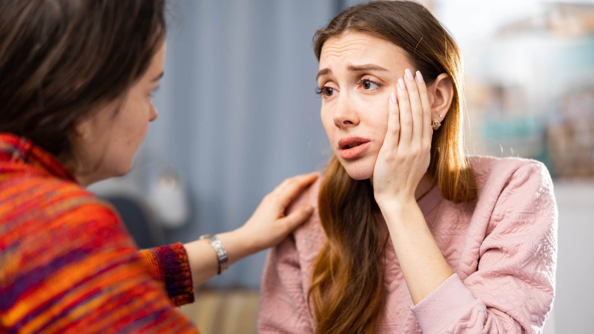 woman rejecting compliment from friend