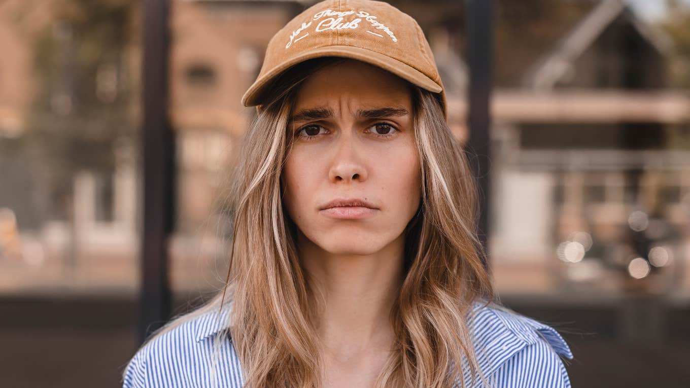 insufferable woman shrugging off responsibilities looking angry