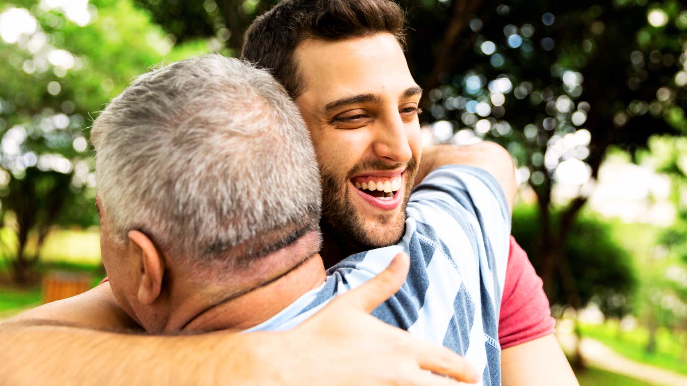Expert hugging their parent.
