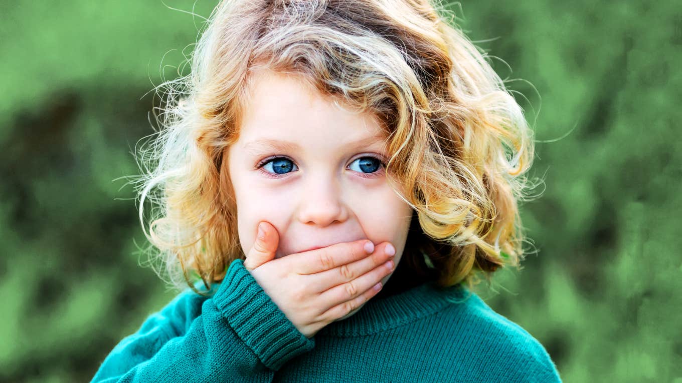 Child not allowed to say these words, covering mouth. 