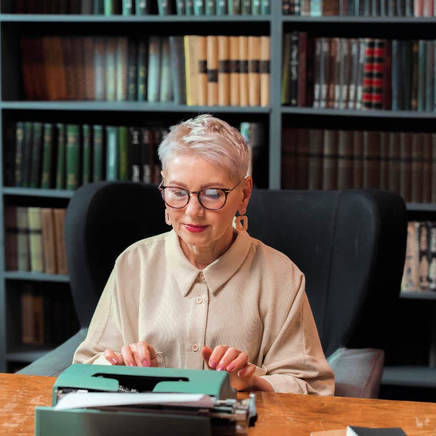 boomer woman using a typewriter