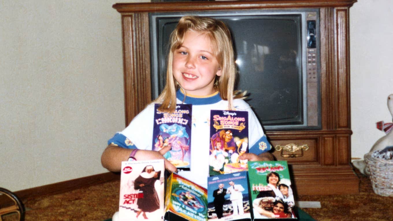 The Lost Art Of Anticipation Vintage photo of child anticipating her VHS tapes.