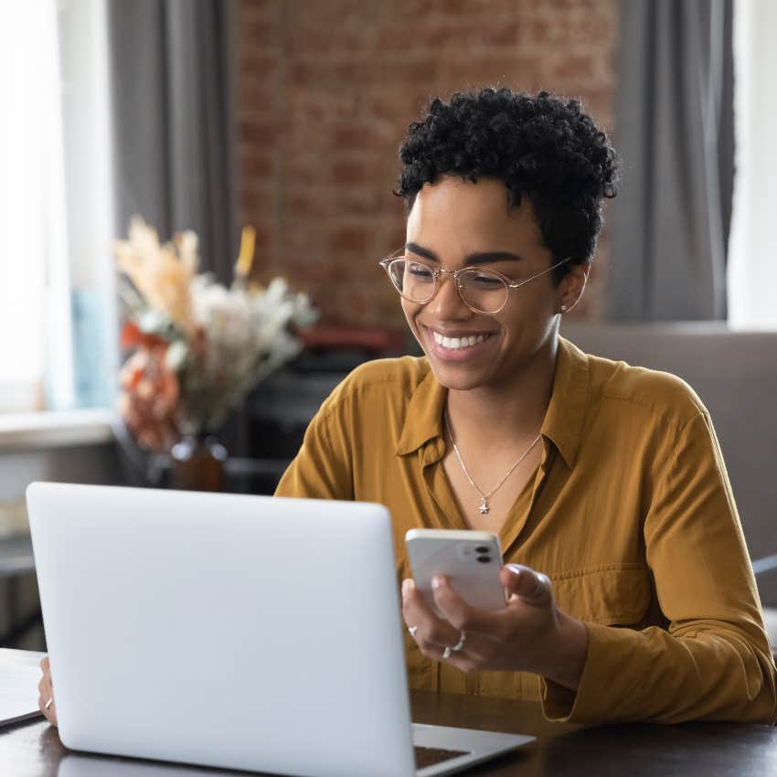 happy woman on laptop as a habit that makes couples unbreakable