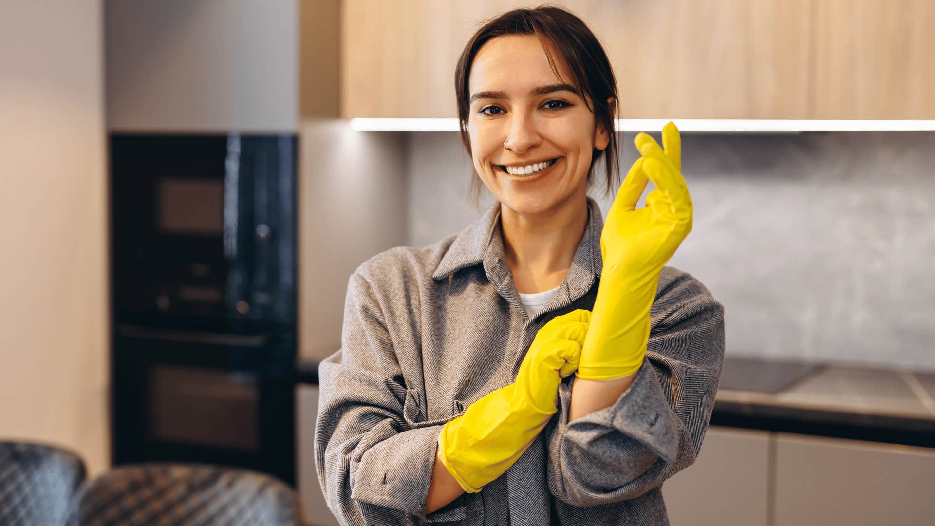 woman with gloves planning to declutter house