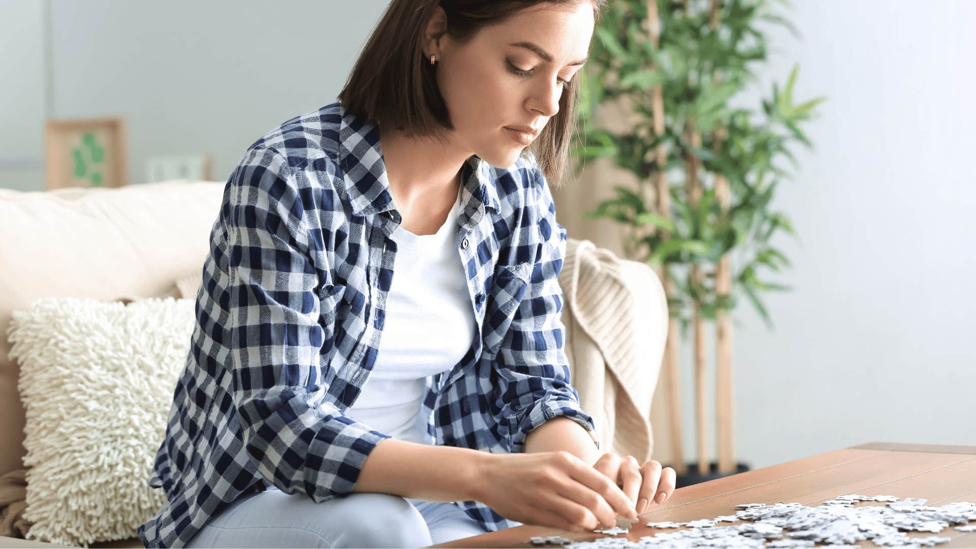 woman doing low-energy hobby of doing simple puzzles