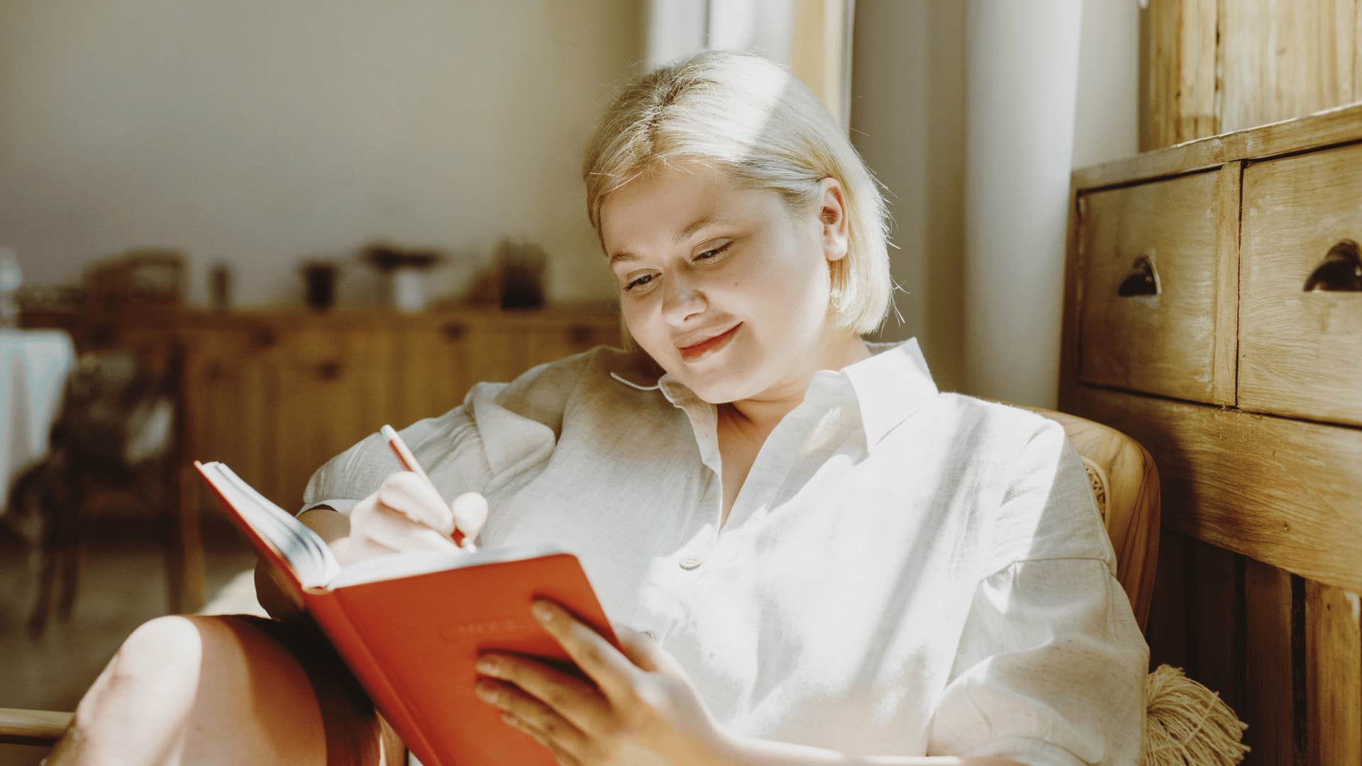 woman doing low-energy hobby of journaling