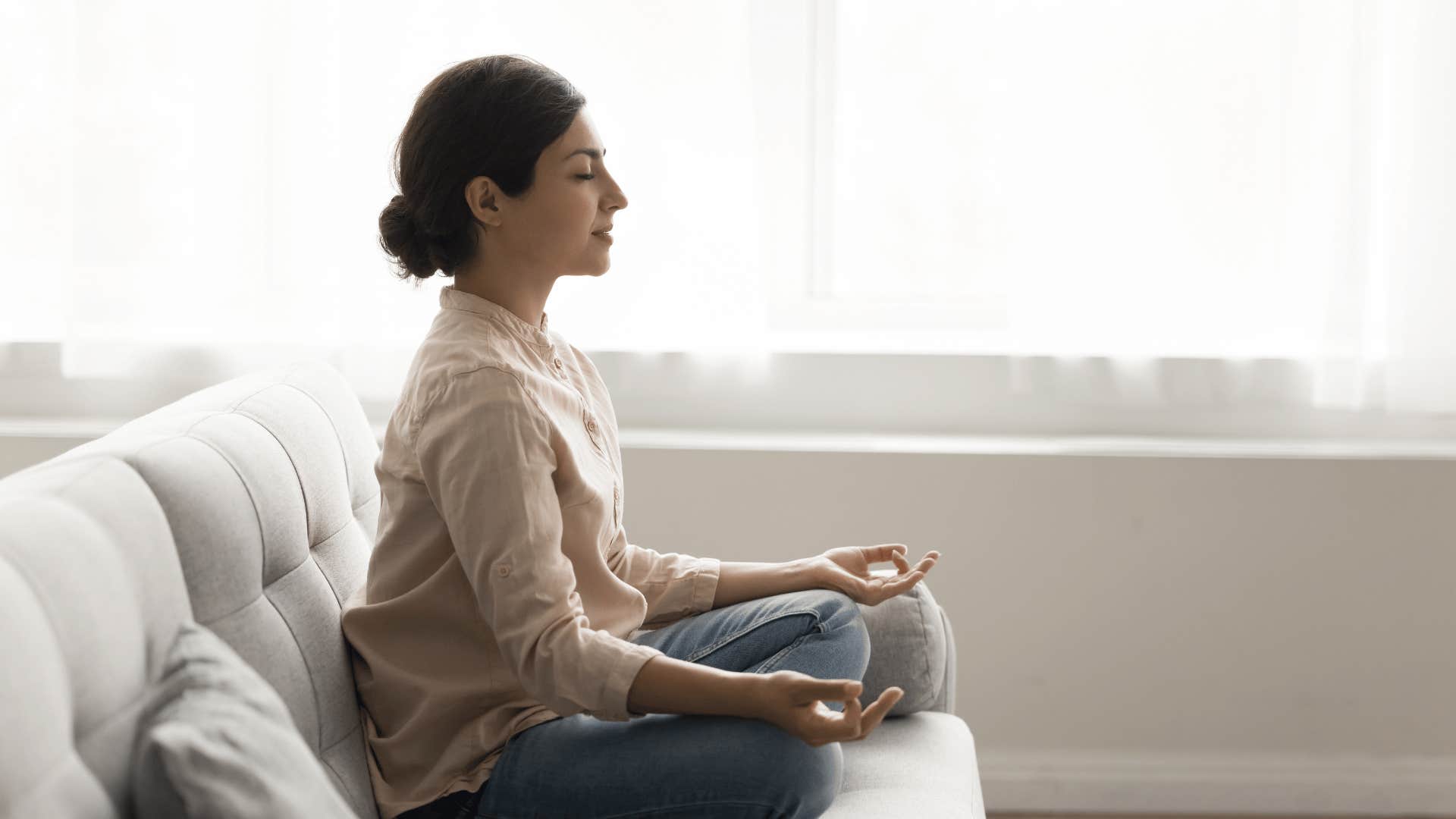 woman doing low-energy hobby of meditating