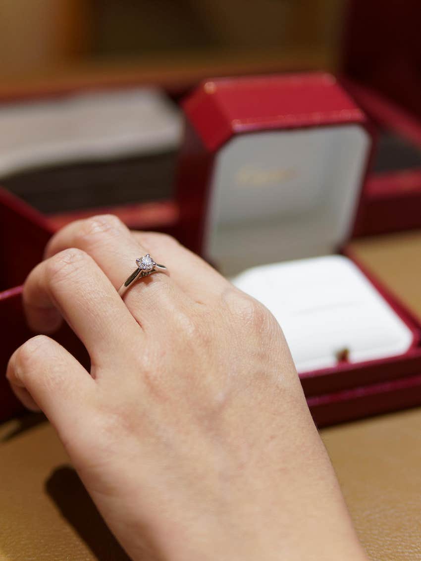 fiancée looking at engagement ring that was not made with real diamond
