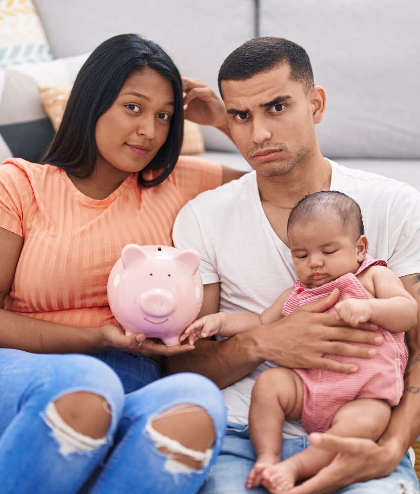 Married couple with baby talk finances to stay together