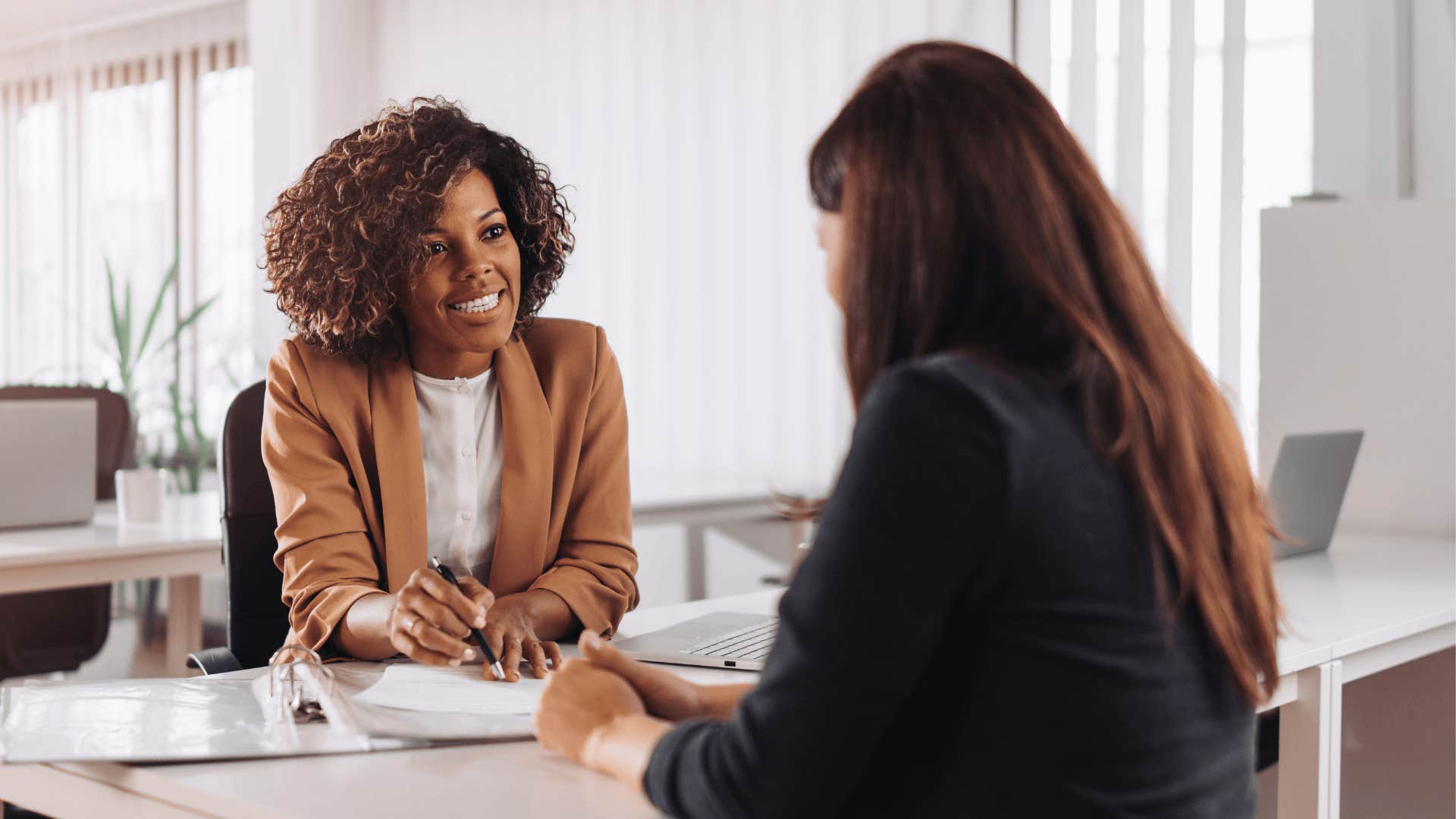 woman at bank who knows millennial money hacks