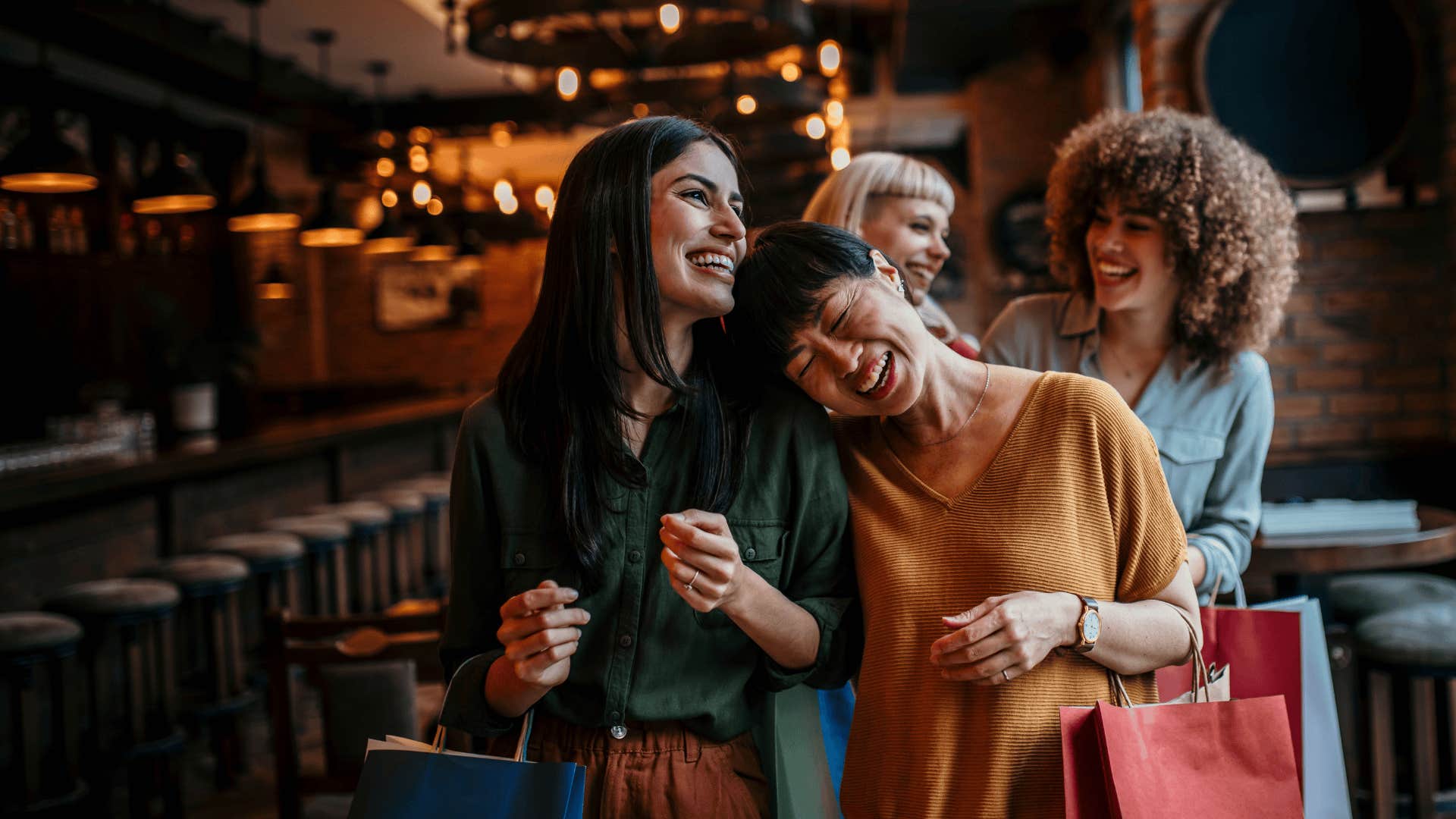group of friends smiling because they know millennial money hacks