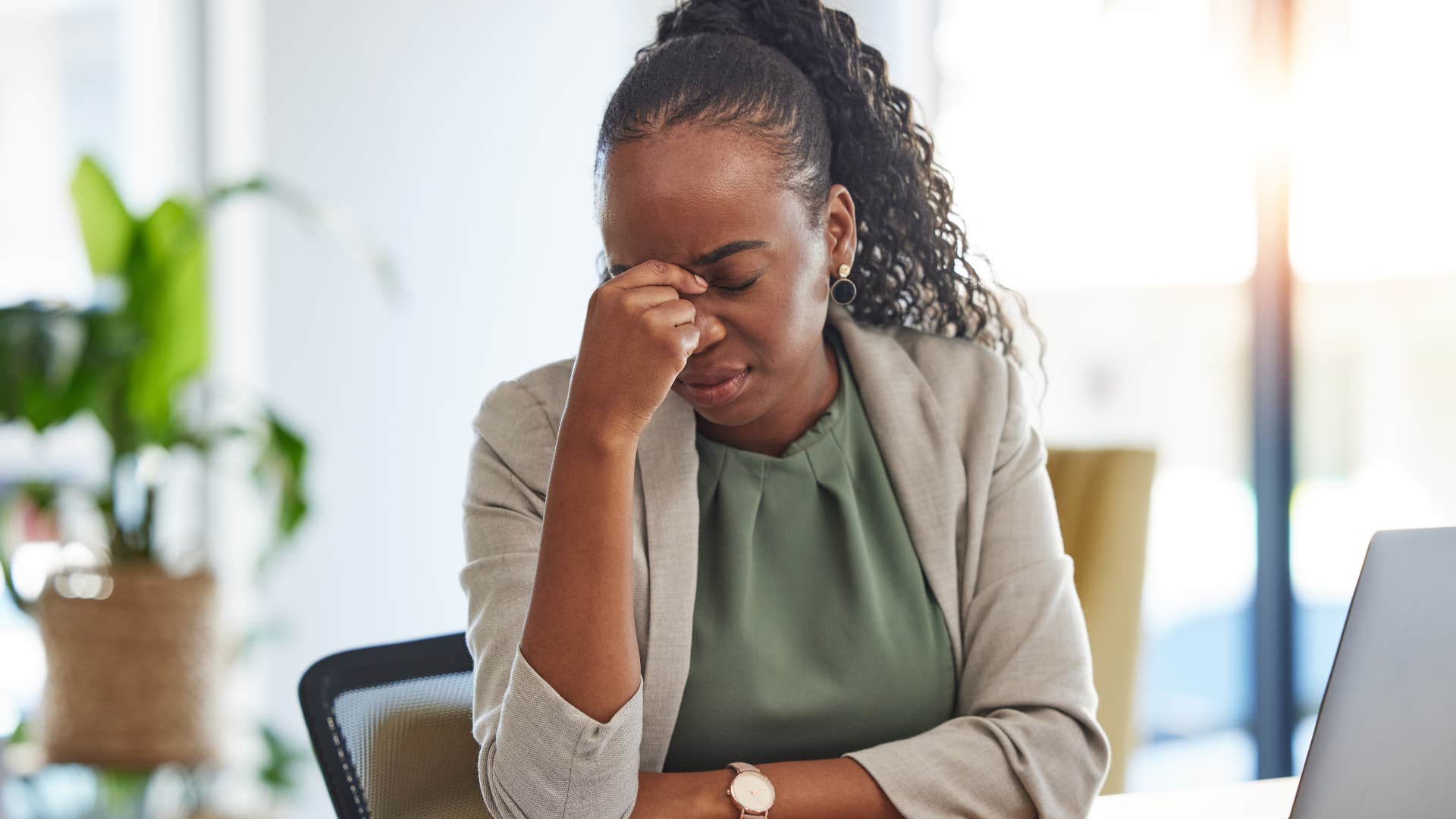 stressed and anxious woman struggling at work