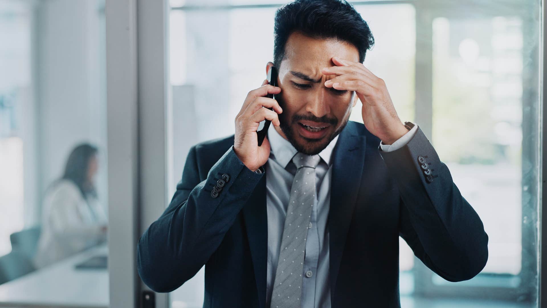 man feeling stressed about unrealistic expectations from boss