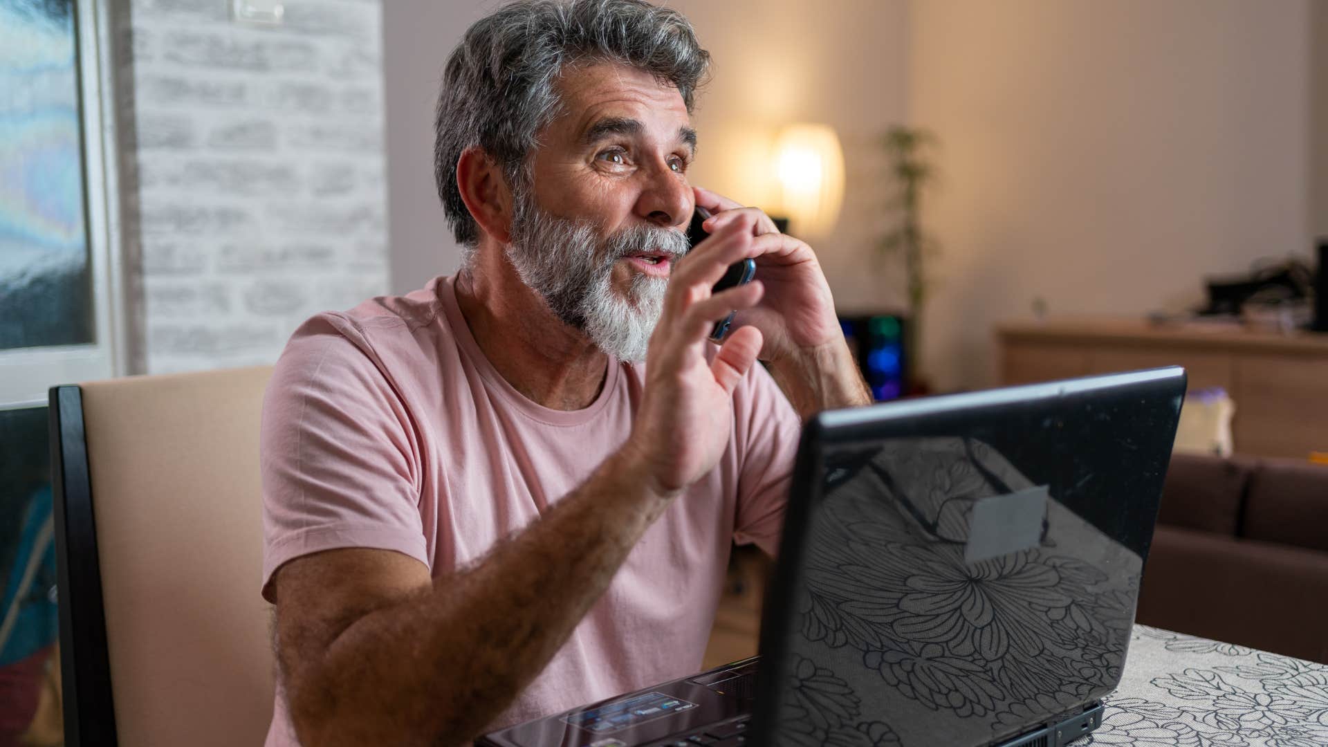 Baby boomer man getting a new phone online.