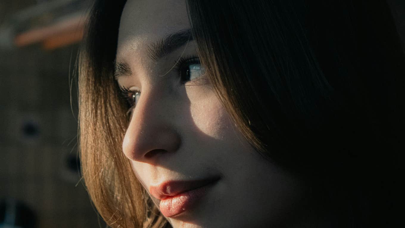 Little Moves That Instantly Spark Attraction, According to Psychology Woman sparks attraction.