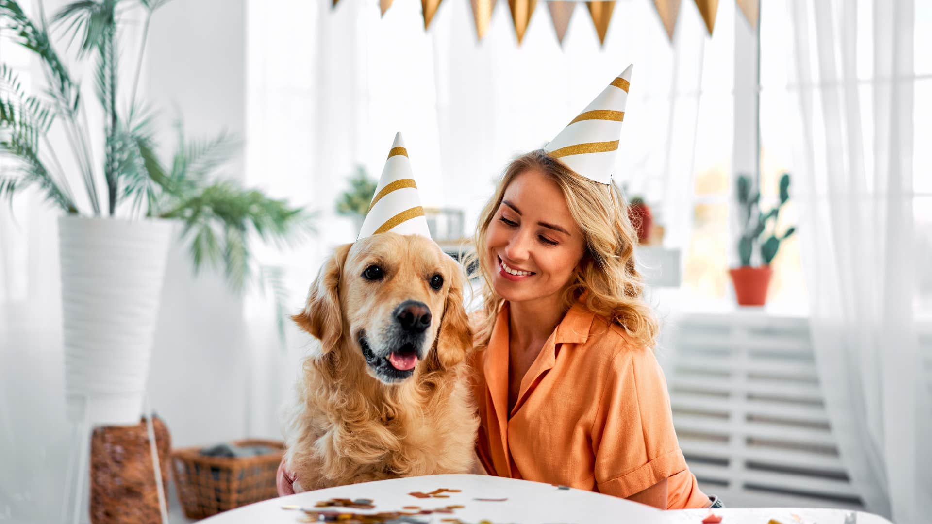 A woman celebrates her dog's birthday
