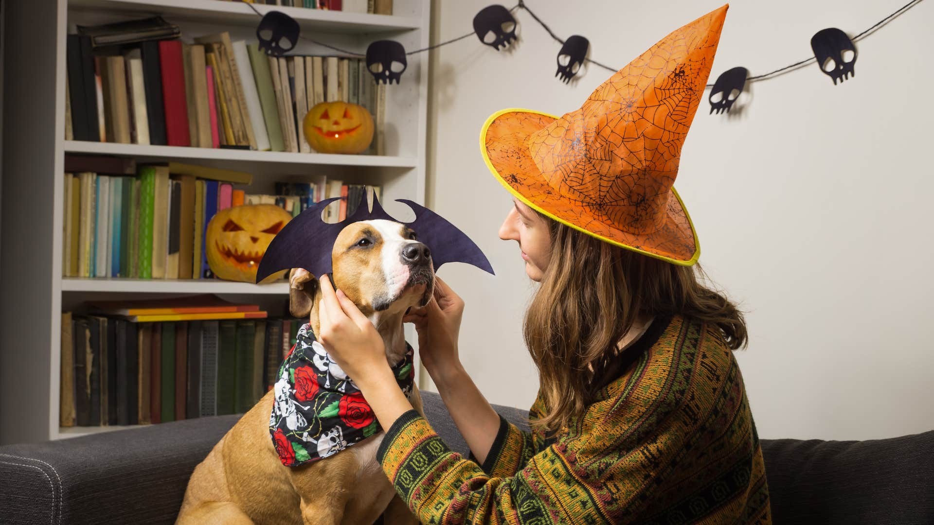A woman and her dog match outfits for Halloween