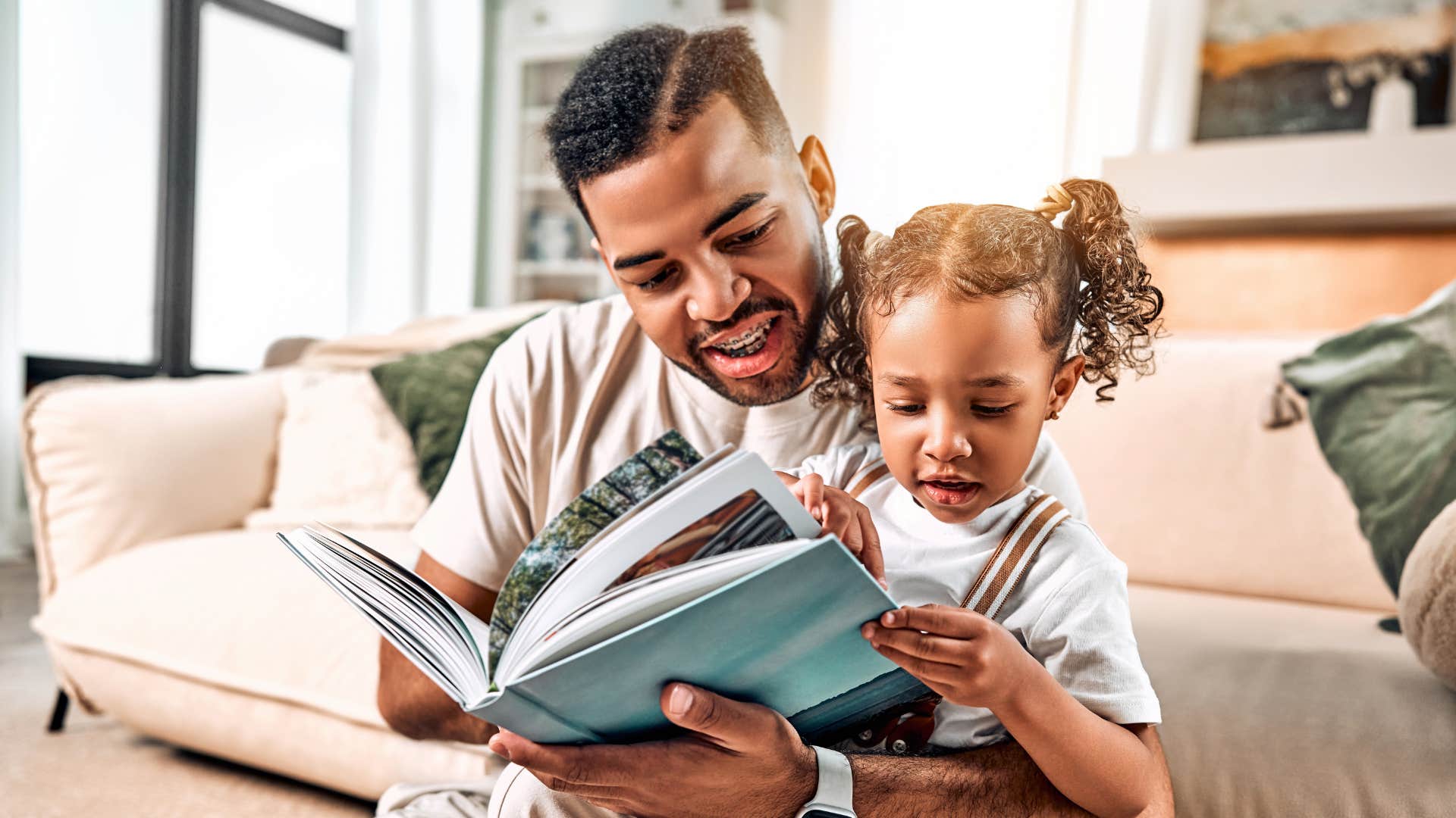 father reading with his daughter