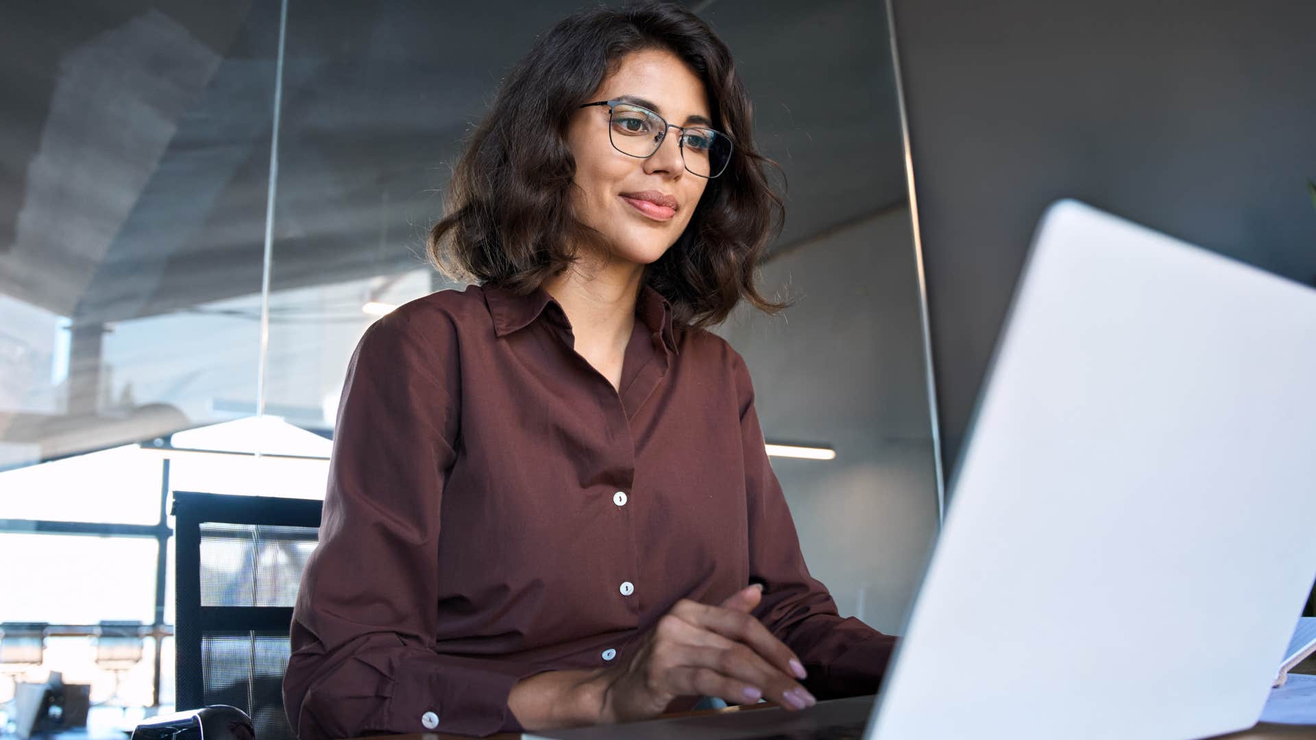 Data entry representative working on her laptop.