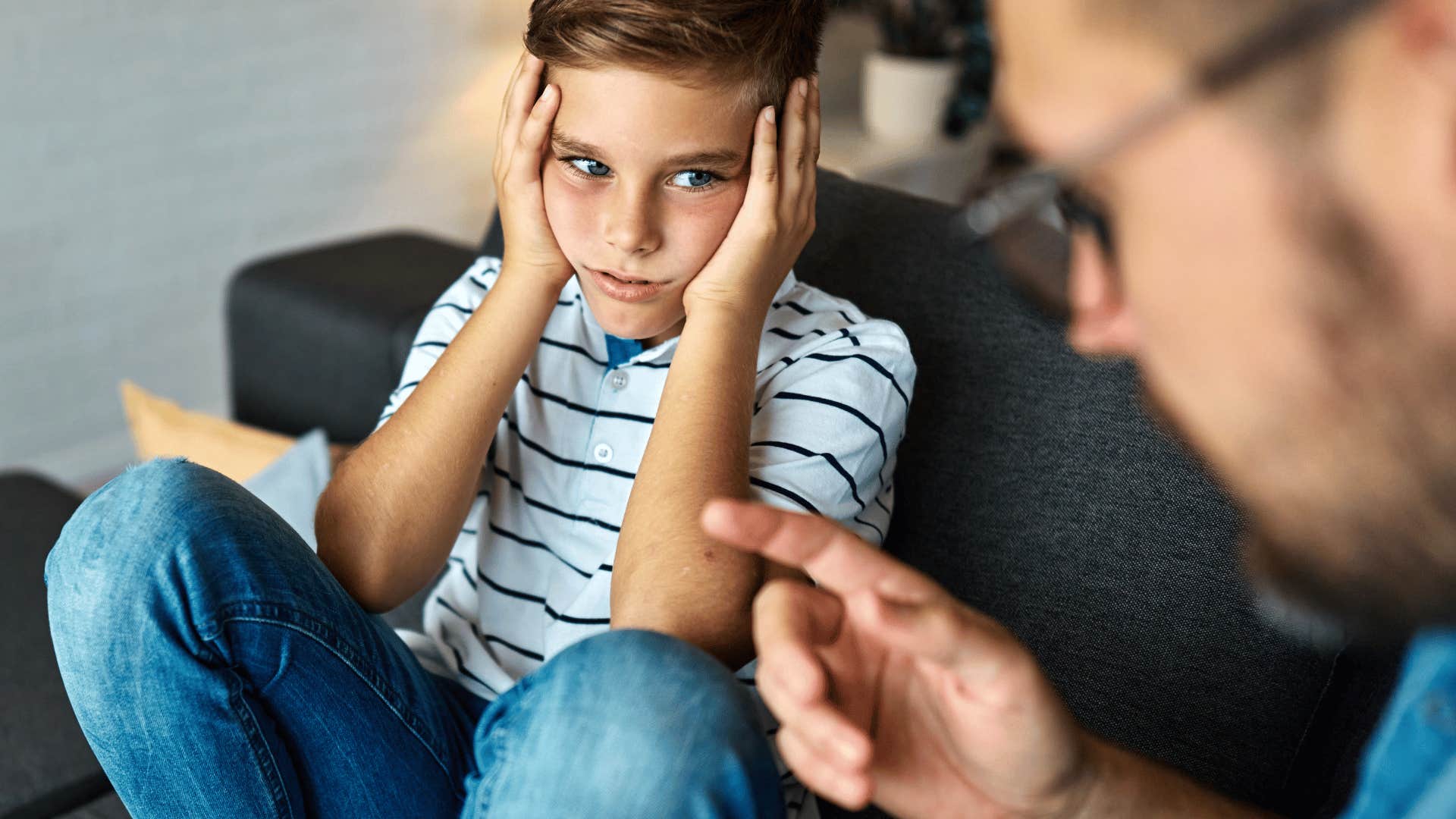 Young boy knows his parent is disappointed