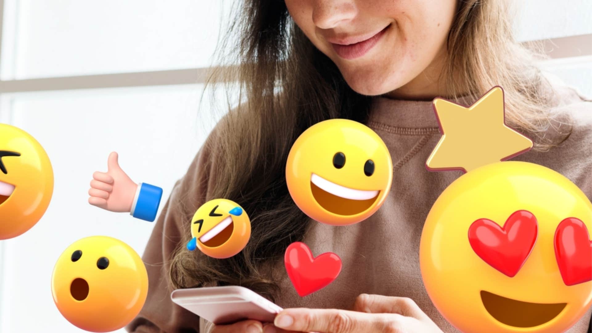 woman texting with an excessive amount of emojis