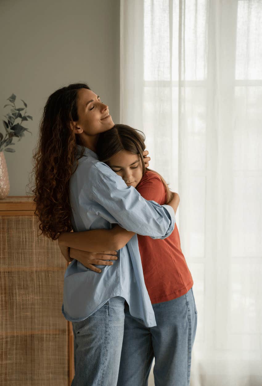 mom letting daughter know her feelings matter by comforting