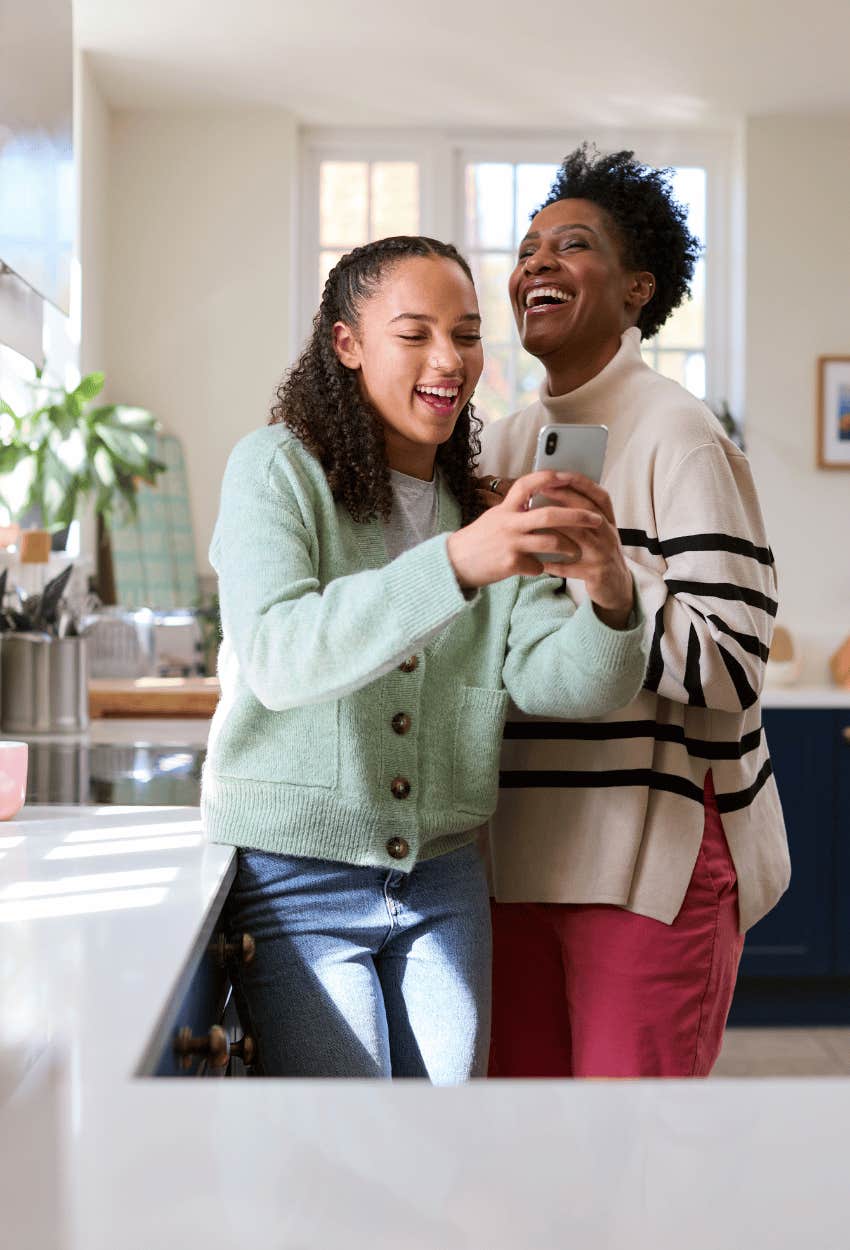 mom and daughter laughing together