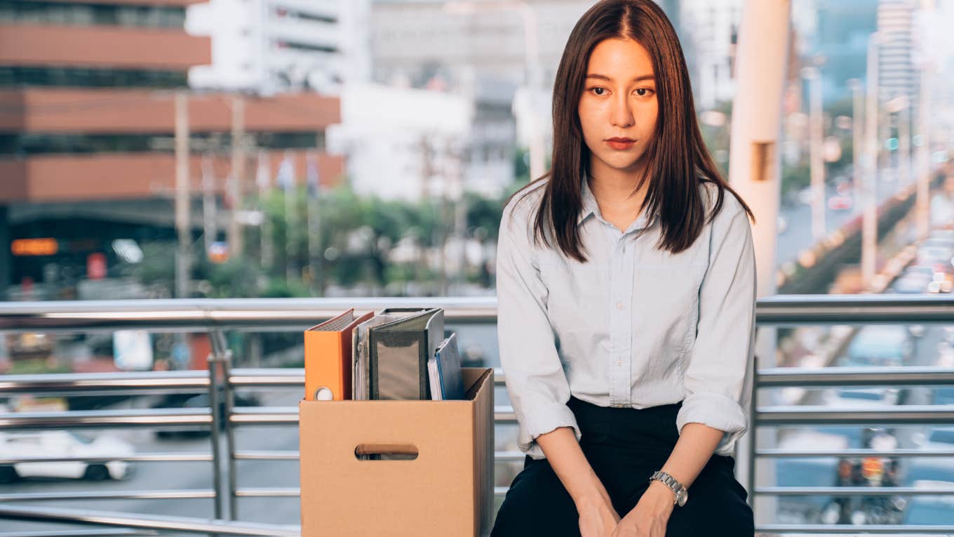 People Are More Likely To Quit Their Jobs Once This Happens woman sitting with box after quitting job