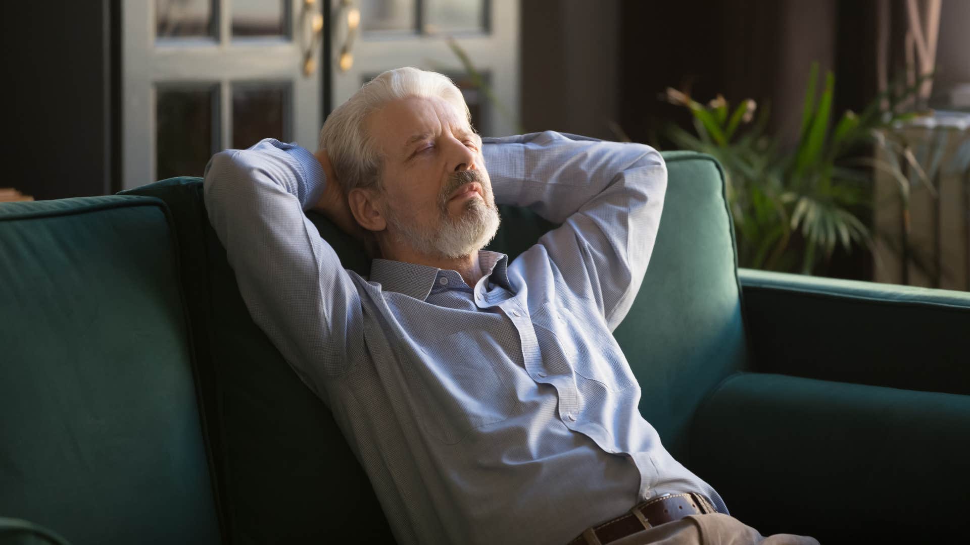 man recharging alone at home after draining social battery