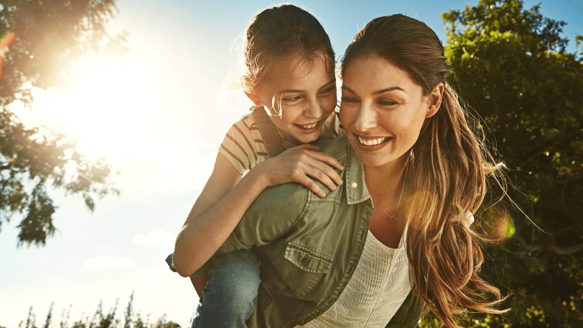 woman who was raised by emotionally immature parents smiling with daughter