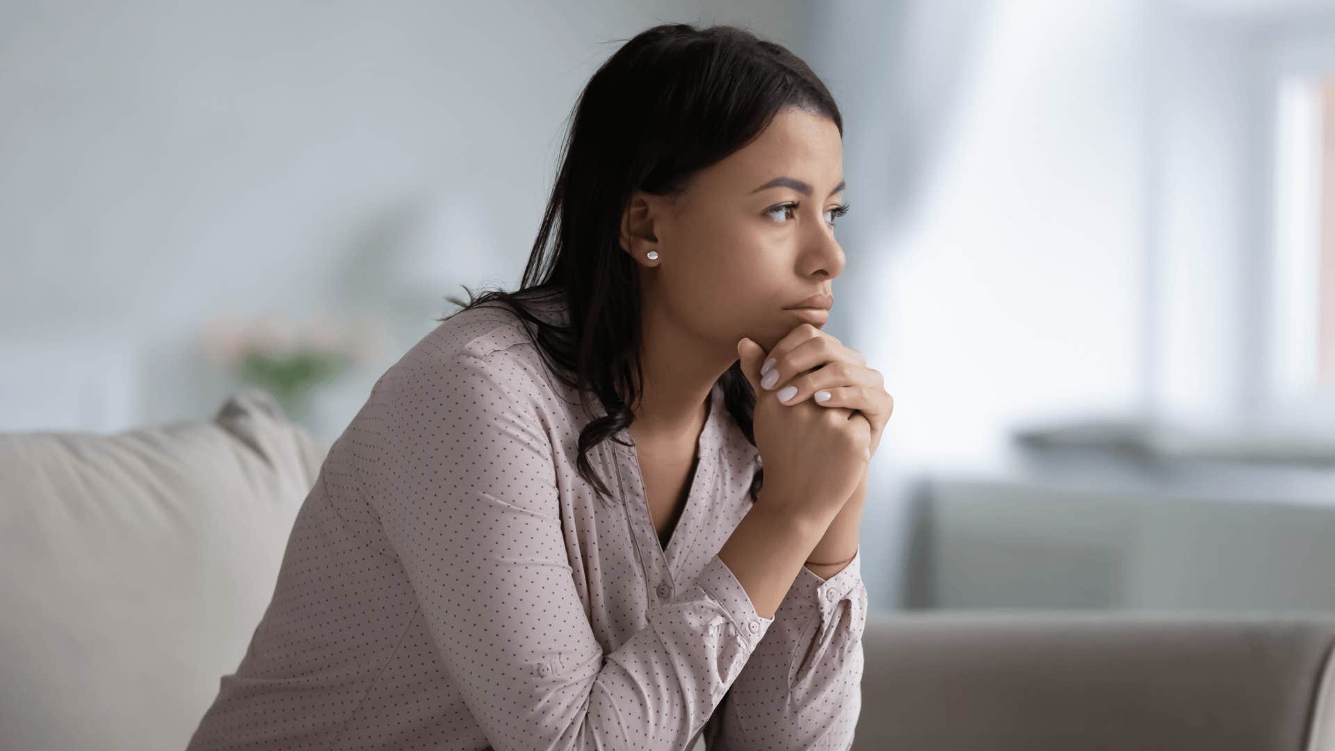upset woman who was raised by emotionally immature parents