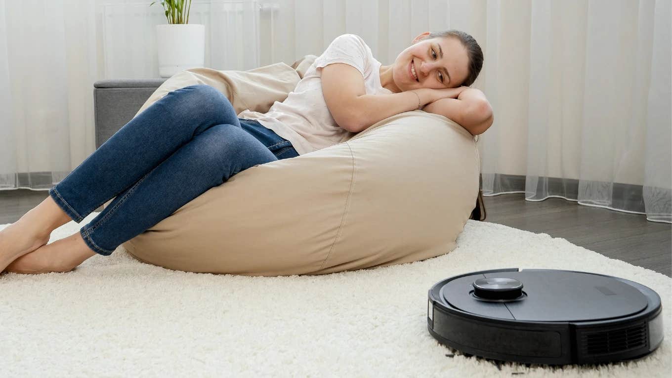 People Think Of Their Roombas As Pets, Studies Show woman who thinks of her roomba as a pet