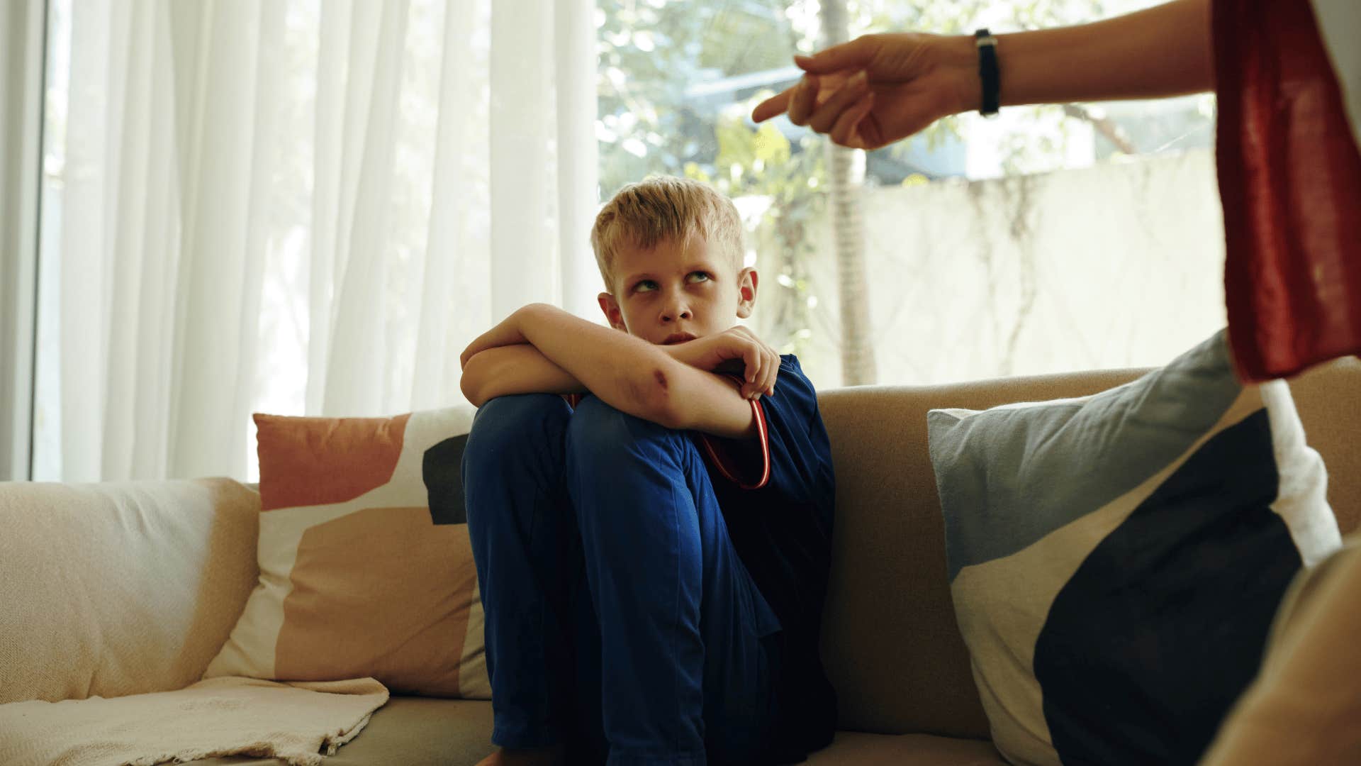 son being berated by manipulative parent