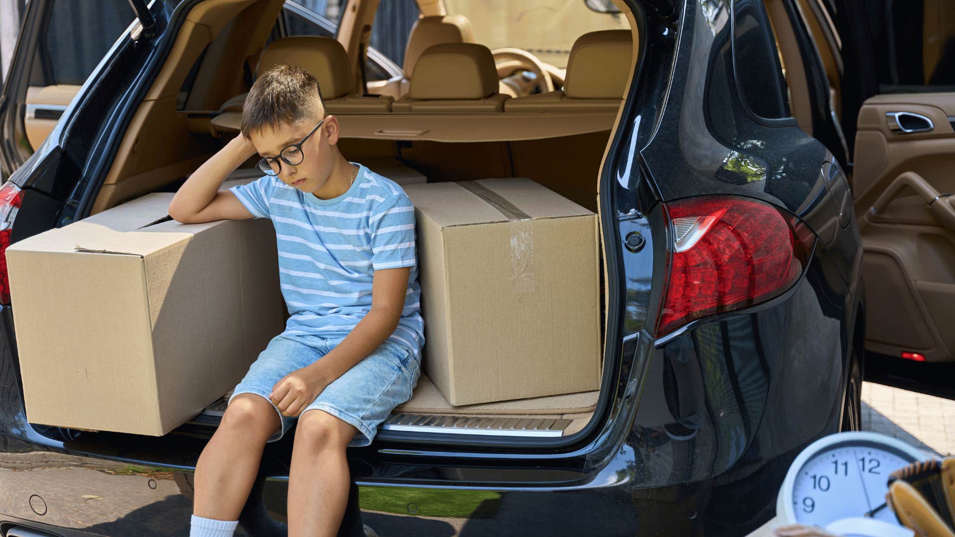 little boy upset at having to move