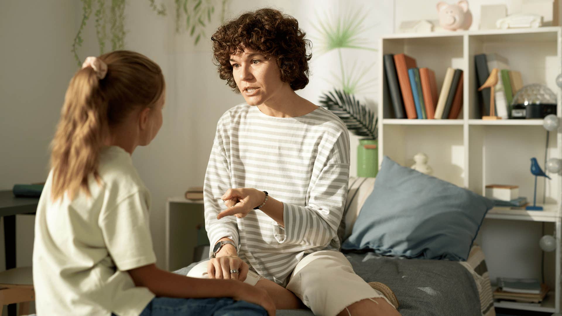 mom chastising daughter not offering any praise