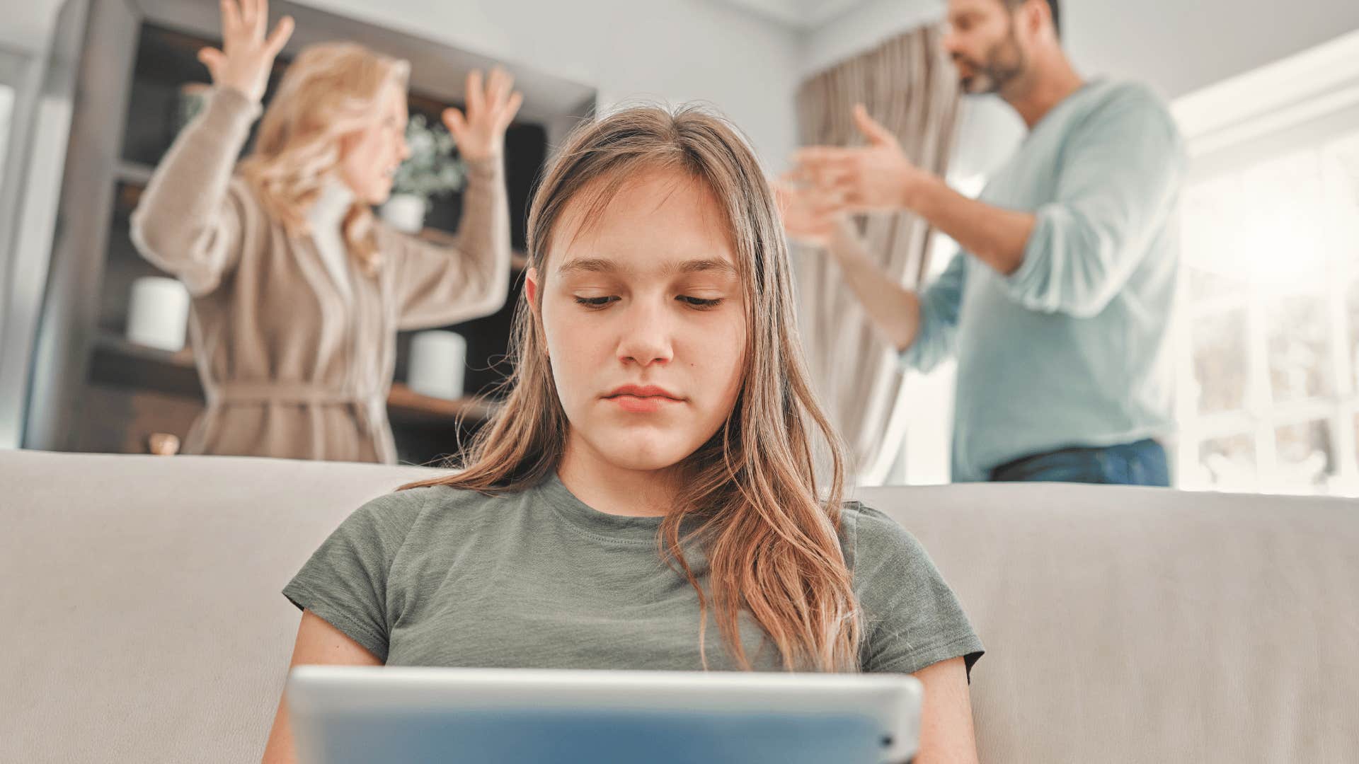 stressed teen girl hearing parents fight