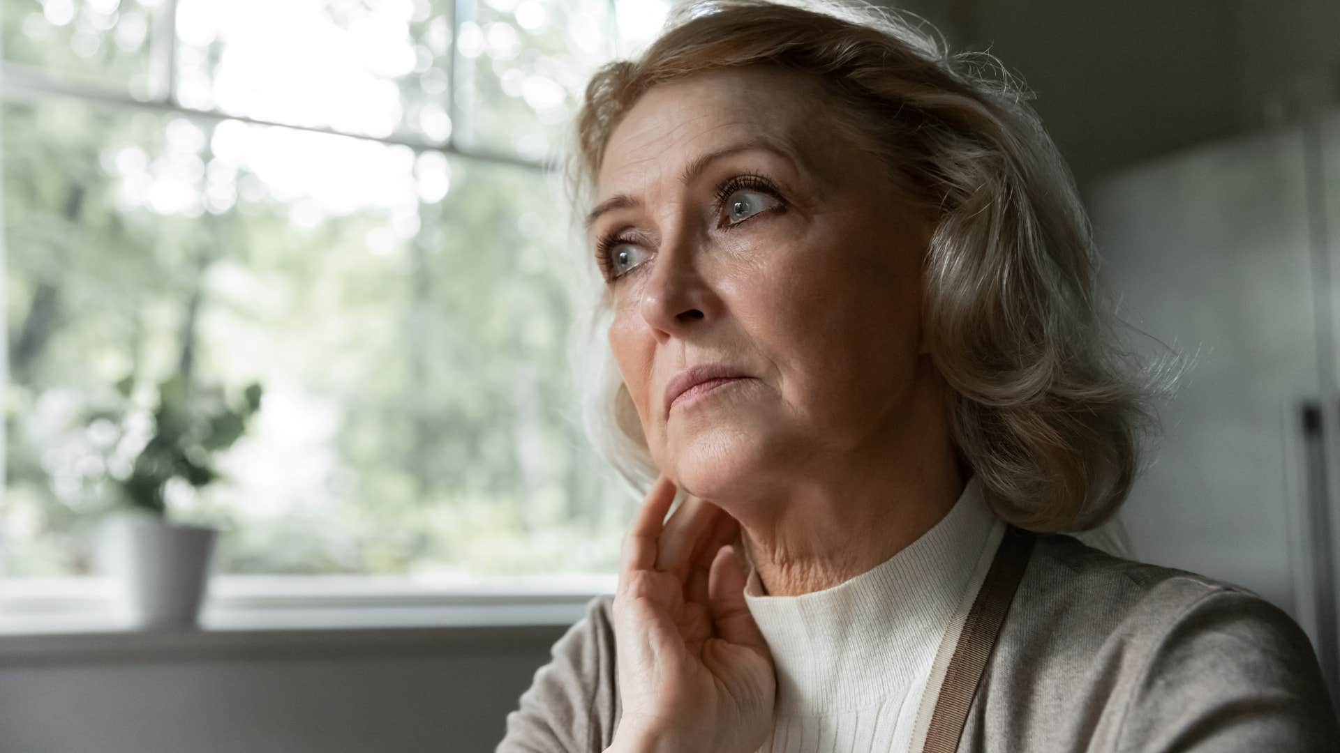 Woman thinking about changing social dynamics and looking away from the camera.