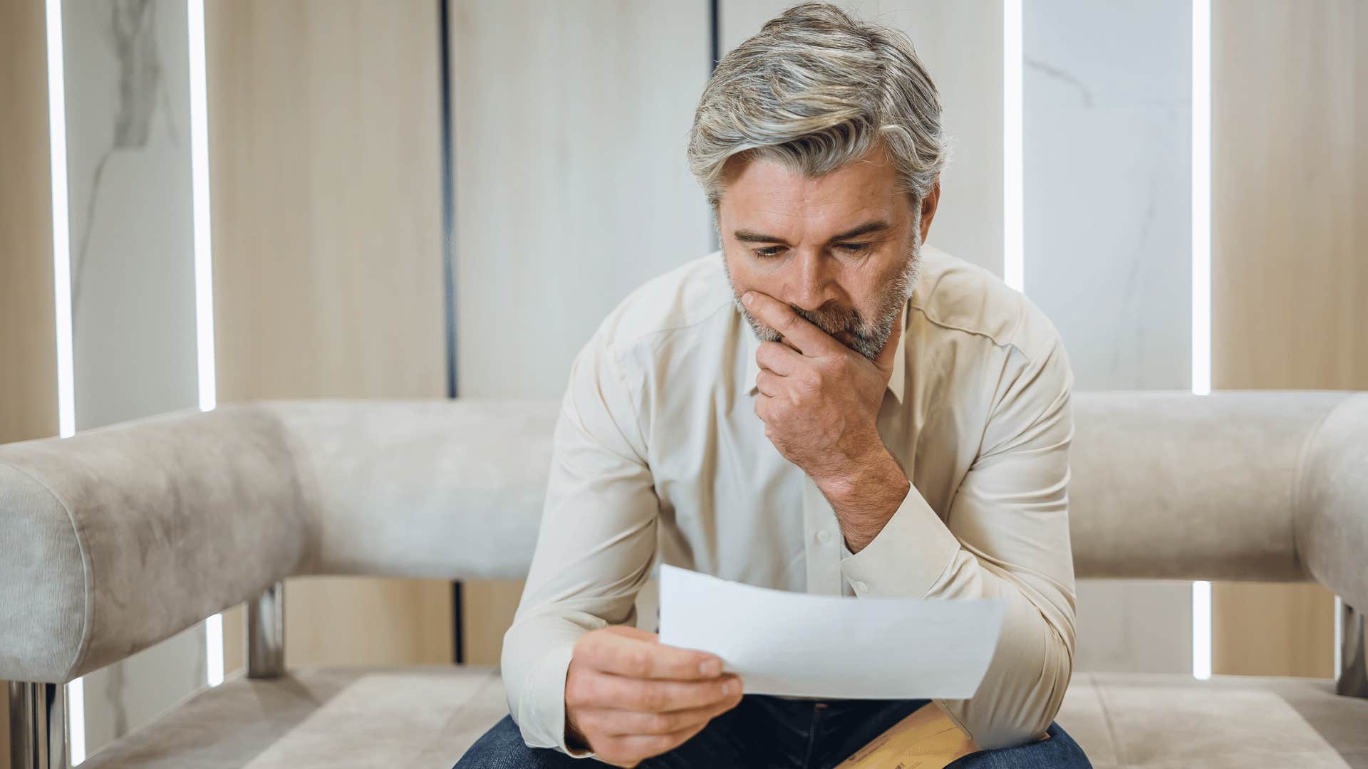 man in fight or flight mode as he reads his mail