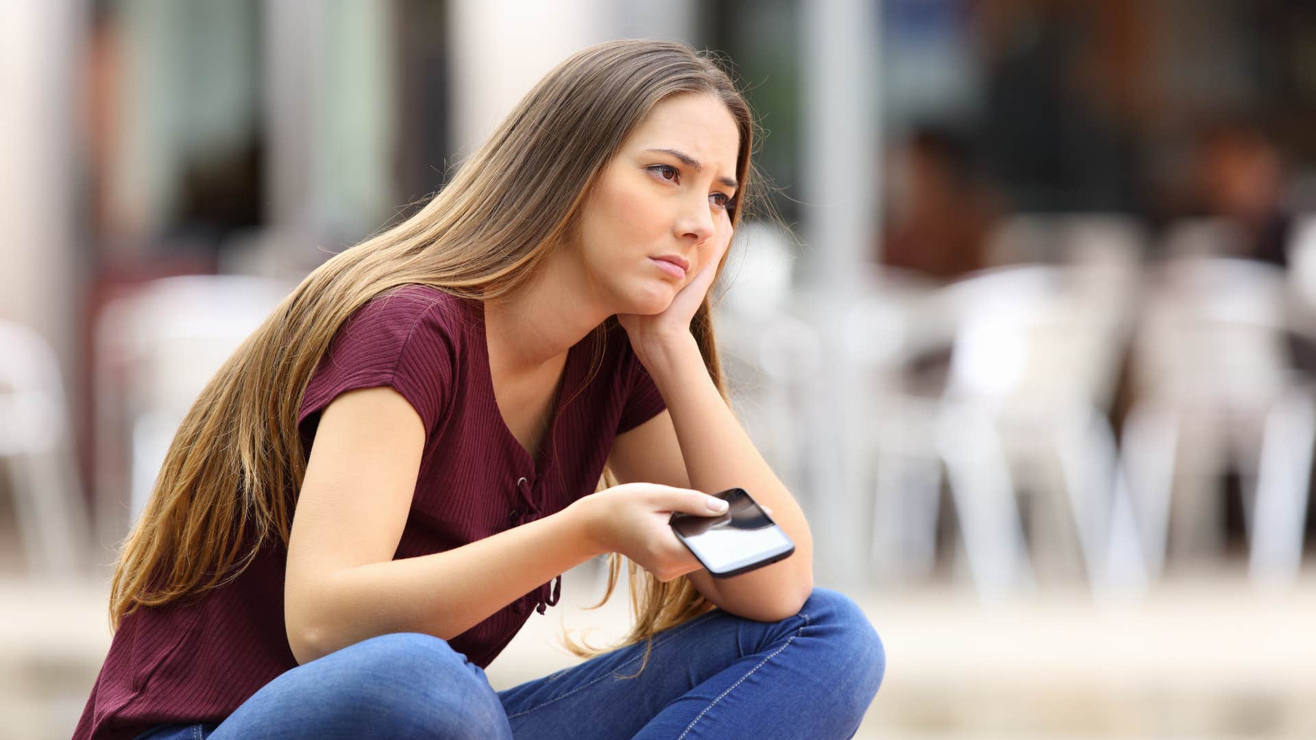 woman is upset that her friends made plans at the last minute