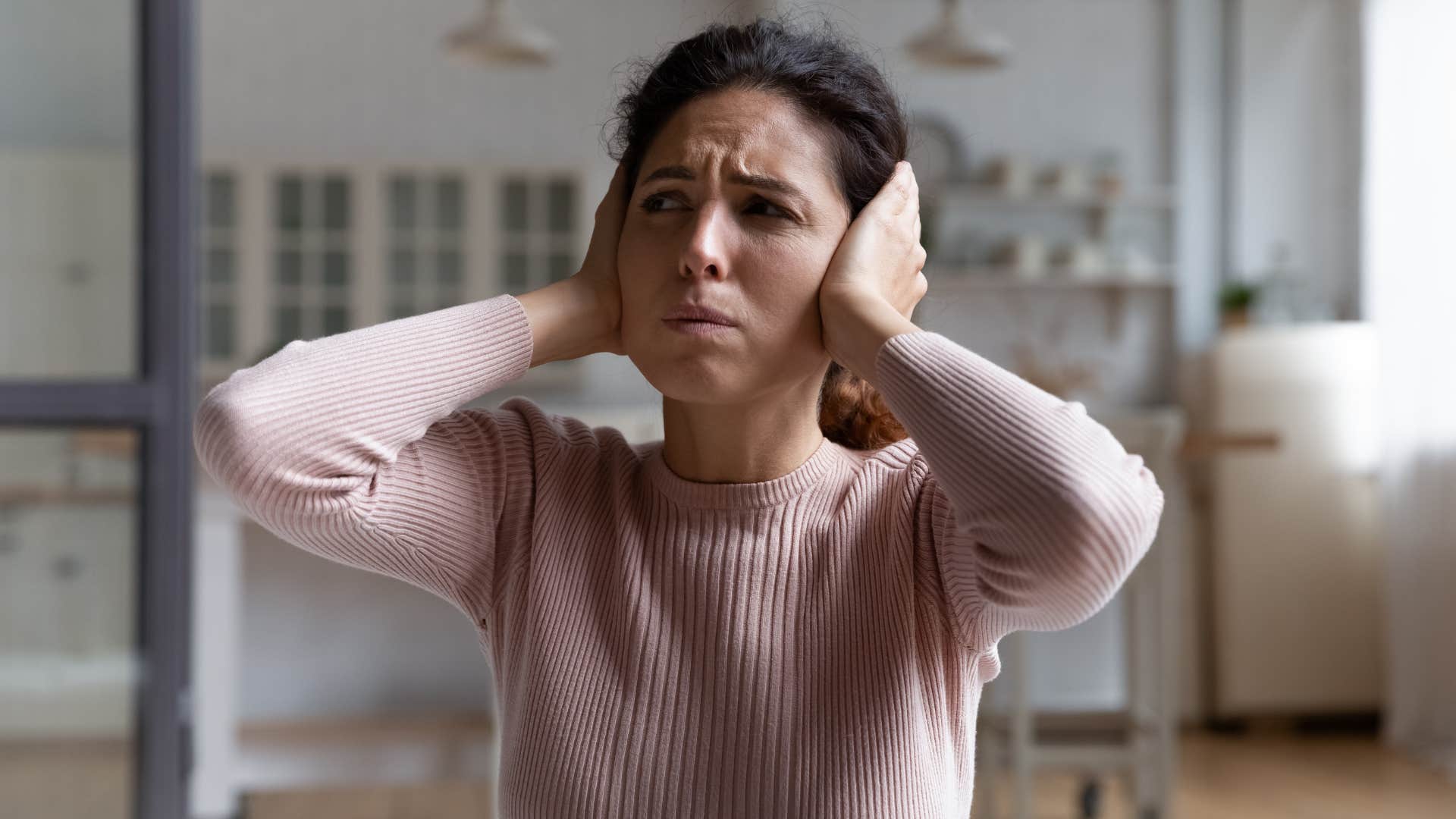 woman who feels everything uncomfortable with loud noises